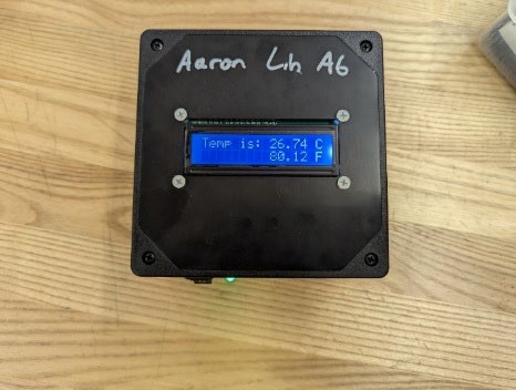 Enclosed Arduino temperature monitor displaying Celsius and Fahrenheit
